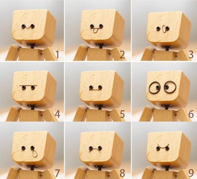 Charmig träfigur med 12 magnetiska ansikten